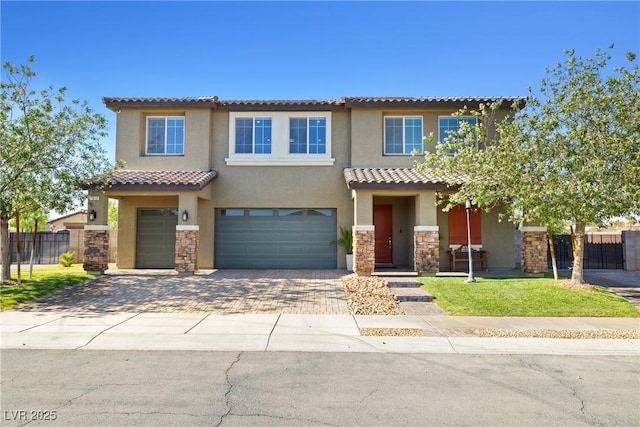 1512 Sagefield Way, Logandale, NV 89021 - view of front of house featuring stucco siding, an attached garage, stone siding, and a tile roof
