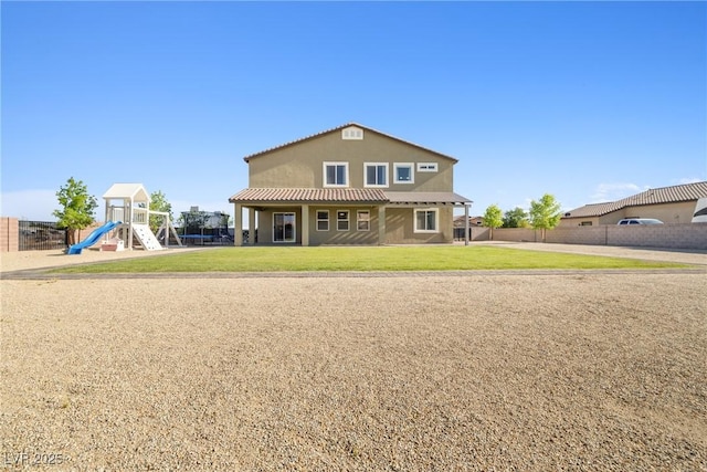 1512 Sagefield Way, Logandale, NV 89021 - rear view of house featuring a playground and stucco siding