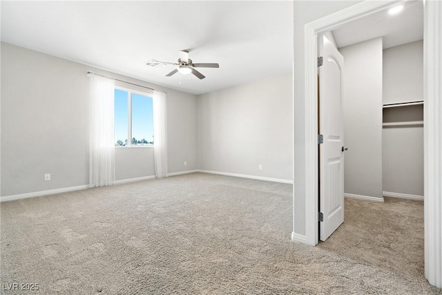 1512 Sagefield Way, Logandale, NV 89021 - unfurnished bedroom with carpet, a spacious closet, and ceiling fan