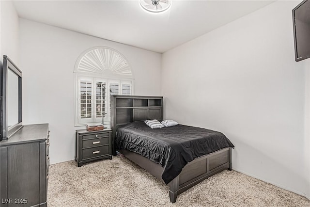 bedroom with light colored carpet