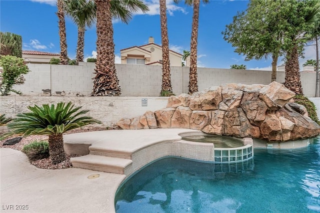 view of swimming pool with fence and a fenced in pool