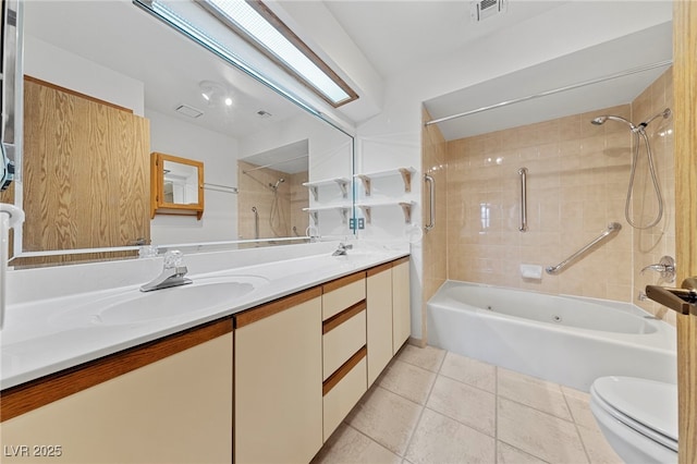 full bath featuring toilet, tile patterned flooring, a sink, and visible vents