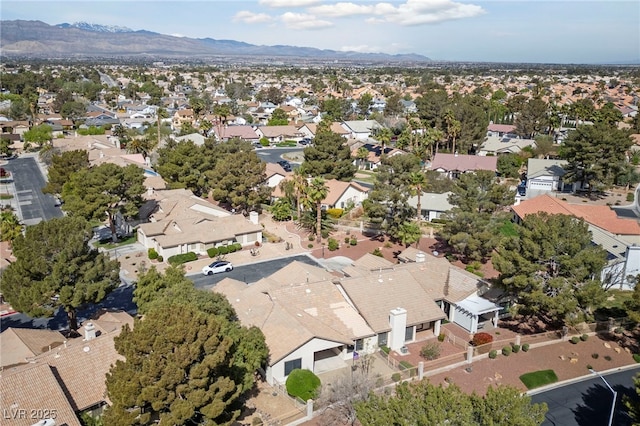 drone / aerial view featuring a residential view and a mountain view