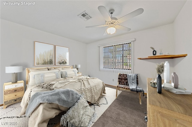 bedroom with carpet floors, visible vents, and baseboards