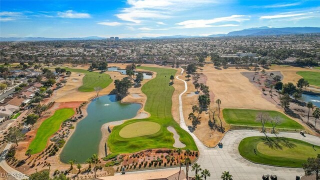 bird's eye view featuring a water and mountain view, golf course view, and a residential view