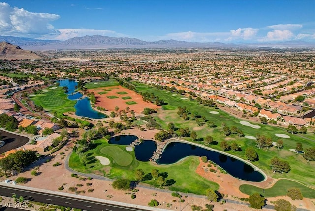 birds eye view of property with golf course view, a water and mountain view, and a residential view