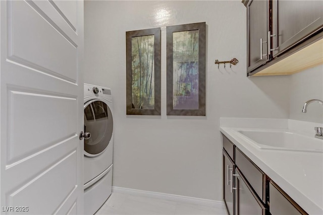 8992 Sparkling River Ct, Las Vegas, NV 89178 - laundry room with cabinet space, washer / dryer, and baseboards
