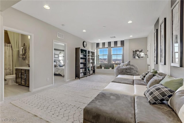 8992 Sparkling River Ct, Las Vegas, NV 89178 - living area featuring light carpet, baseboards, and recessed lighting