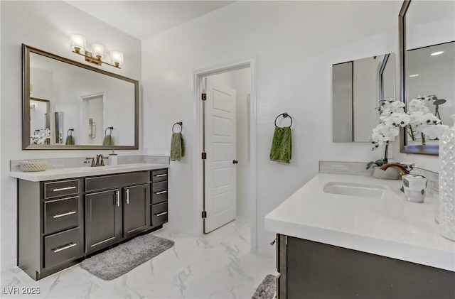 8992 Sparkling River Ct, Las Vegas, NV 89178 - bathroom with two vanities, marble look tiles, and baseboards