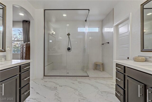 8992 Sparkling River Ct, Las Vegas, NV 89178 - bathroom with walk in shower, two vanities, marble finish flooring, and recessed lighting