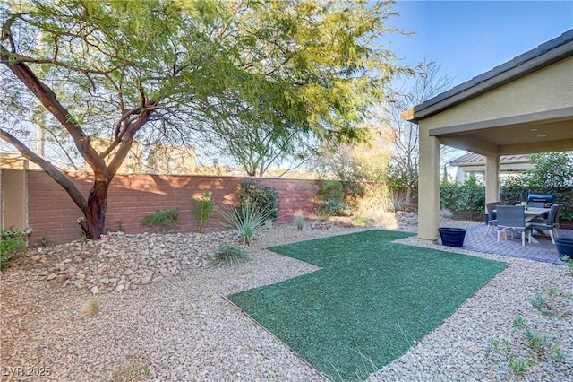 8992 Sparkling River Ct, Las Vegas, NV 89178 - fenced backyard featuring a patio