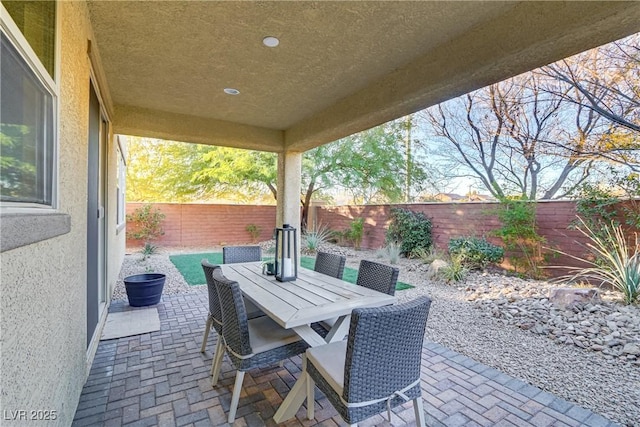 8992 Sparkling River Ct, Las Vegas, NV 89178 - fenced backyard with a patio and outdoor dining area