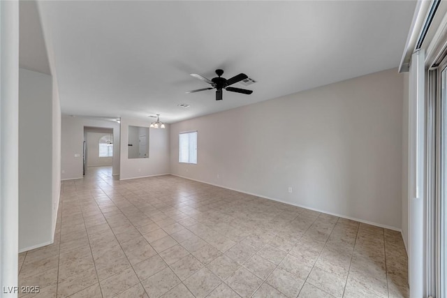 6116 Tokara Ave, Las Vegas, NV 89122 - unfurnished room with ceiling fan with notable chandelier, baseboards, visible vents, and light tile patterned floors