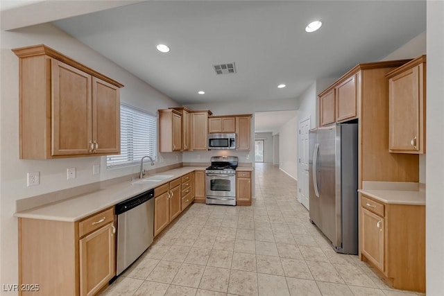 6116 Tokara Ave, Las Vegas, NV 89122 - kitchen with a sink, visible vents, recessed lighting, light countertops, and appliances with stainless steel finishes