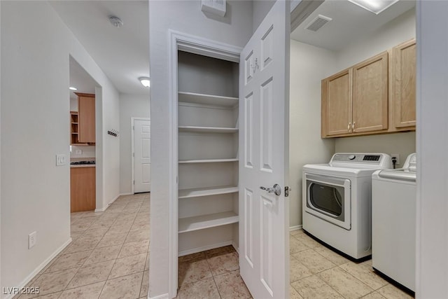6116 Tokara Ave, Las Vegas, NV 89122 - washroom with baseboards, cabinet space, and independent washer and dryer