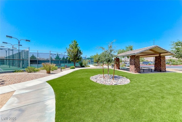 6116 Tokara Ave, Las Vegas, NV 89122 - view of property's community with fence, a gazebo, a yard, and a tennis court