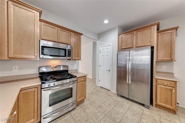 6116 Tokara Ave, Las Vegas, NV 89122 - kitchen with light countertops, appliances with stainless steel finishes, light tile patterned flooring, and recessed lighting