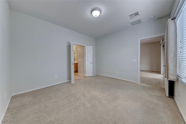 6116 Tokara Ave, Las Vegas, NV 89122 - unfurnished bedroom featuring visible vents and light colored carpet