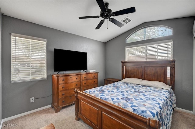 bedroom with vaulted ceiling, visible vents, baseboards, and light carpet