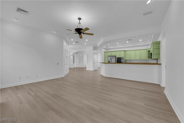 4722 Blue Mesa Way, Las Vegas, NV 89129 - unfurnished living room featuring recessed lighting, light wood-type flooring, ceiling fan, and arched walkways