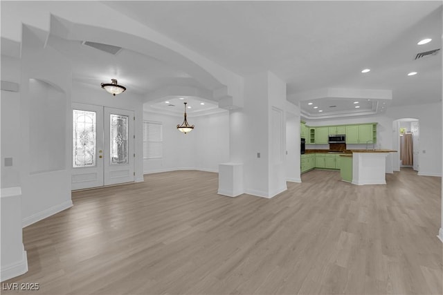 4722 Blue Mesa Way, Las Vegas, NV 89129 - unfurnished living room with recessed lighting, arched walkways, light wood finished floors, and baseboards
