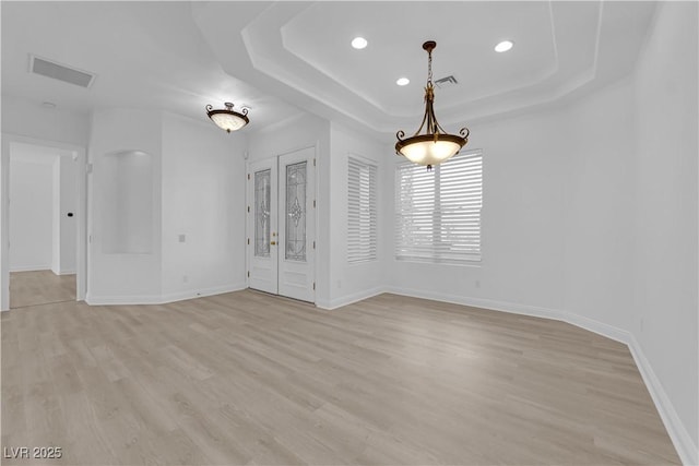 4722 Blue Mesa Way, Las Vegas, NV 89129 - empty room featuring a tray ceiling, light wood finished floors, and recessed lighting