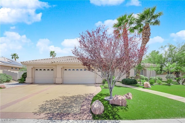4722 Blue Mesa Way, Las Vegas, NV 89129 - view of front of property featuring stucco siding, concrete driveway, a garage, a tile roof, and a front yard