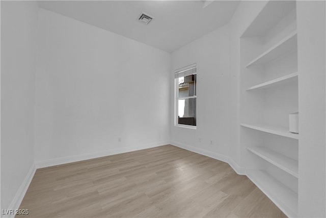 4722 Blue Mesa Way, Las Vegas, NV 89129 - empty room featuring wood finished floors and built in shelves