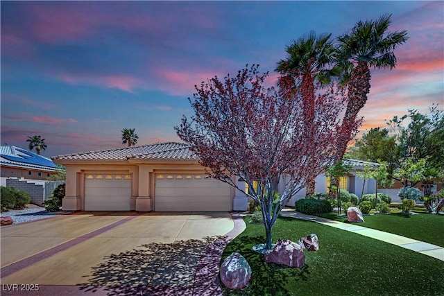 4722 Blue Mesa Way, Las Vegas, NV 89129 - view of front of property featuring a tile roof, stucco siding, concrete driveway, a yard, and a garage
