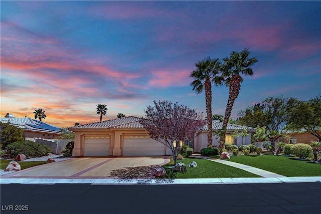 4722 Blue Mesa Way, Las Vegas, NV 89129 - view of front of home featuring concrete driveway, a garage, a yard, a tile roof, and stucco siding