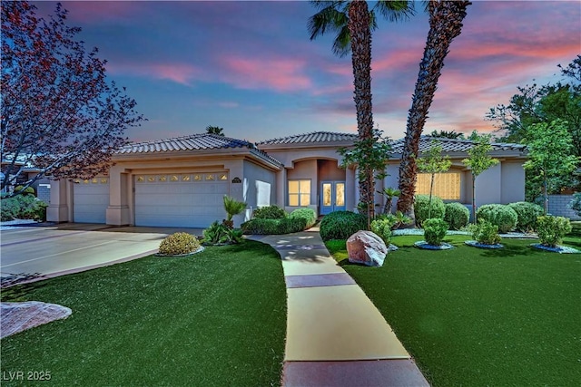 4722 Blue Mesa Way, Las Vegas, NV 89129 - mediterranean / spanish home with a tile roof, an attached garage, a front lawn, and concrete driveway