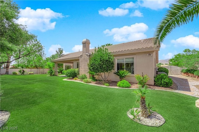 4722 Blue Mesa Way, Las Vegas, NV 89129 - rear view of property featuring a tiled roof, stucco siding, and a chimney