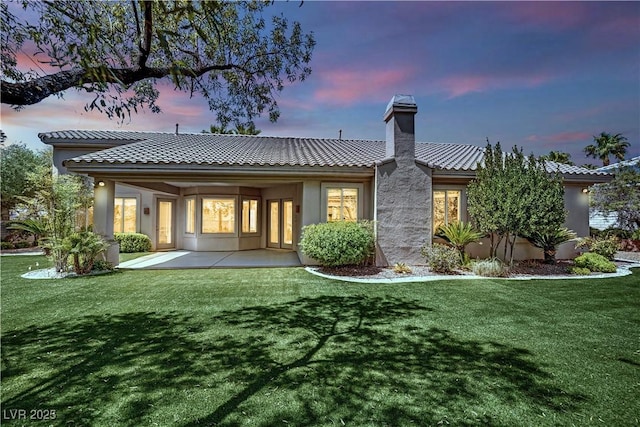 4722 Blue Mesa Way, Las Vegas, NV 89129 - back of property featuring a lawn and stucco siding