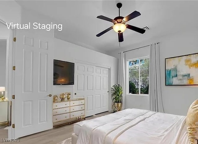 4722 Blue Mesa Way, Las Vegas, NV 89129 - bedroom with a closet, light wood-type flooring, and ceiling fan
