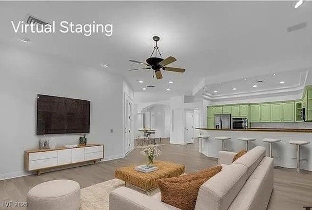 4722 Blue Mesa Way, Las Vegas, NV 89129 - living room with recessed lighting, light wood finished floors, a ceiling fan, and arched walkways