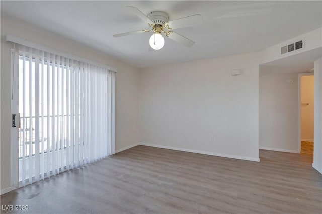 3953 Rebecca Raiter Ave Unit 202, Las Vegas, NV 89110 - empty room featuring baseboards, ceiling fan, wood finished floors, and visible vents