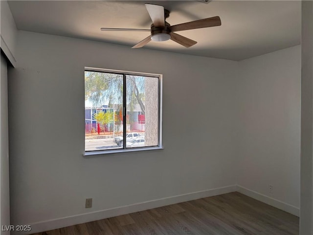 3275 Arville St Unit C, Las Vegas, NV 89102 - unfurnished room with baseboards, wood finished floors, and ceiling fan