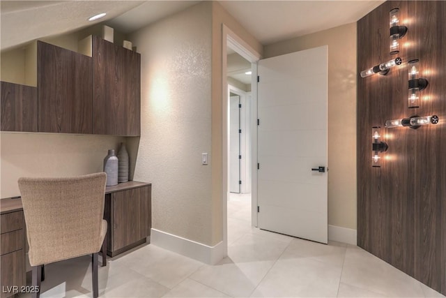 8808 Rozetta Ct, Las Vegas, NV 89134 - unfurnished office featuring baseboards, a textured wall, and light tile patterned floors