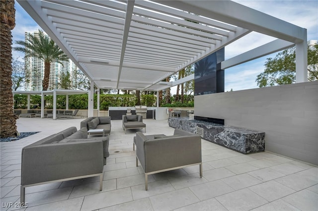 view of patio / terrace featuring a pergola and outdoor lounge area