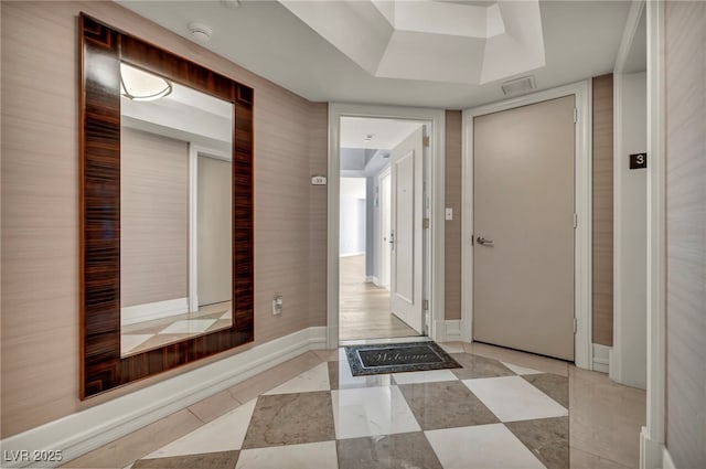 hallway featuring tile patterned flooring