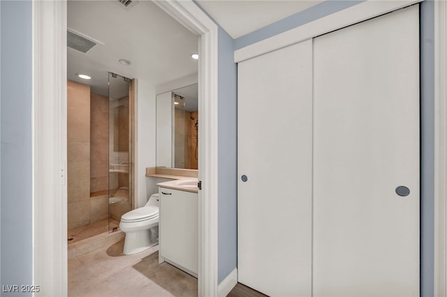 full bath with visible vents, vanity, toilet, recessed lighting, and a shower stall