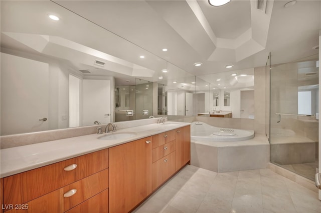 full bathroom featuring visible vents, a sink, a garden tub, and a stall shower