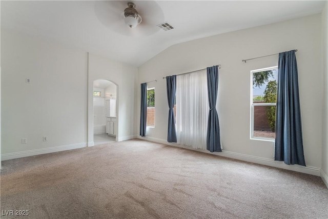 4360 Meadowlark Wing Way N, Las Vegas, NV 89084 - carpeted empty room with arched walkways, plenty of natural light, ceiling fan, lofted ceiling, and baseboards