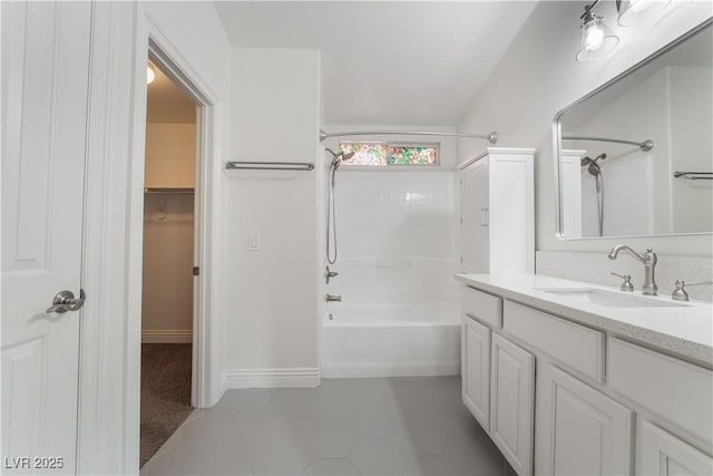 4360 Meadowlark Wing Way N, Las Vegas, NV 89084 - bathroom featuring vanity, tub / shower combination, a walk in closet, and baseboards