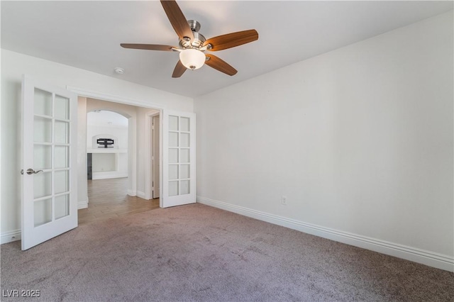 4360 Meadowlark Wing Way N, Las Vegas, NV 89084 - spare room with french doors, carpet, a ceiling fan, baseboards, and arched walkways