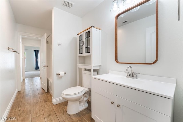 4360 Meadowlark Wing Way N, Las Vegas, NV 89084 - bathroom with wood finished floors, vanity, toilet, and baseboards
