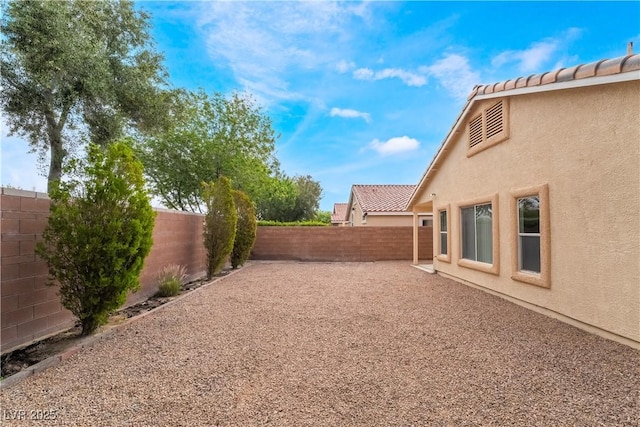 4360 Meadowlark Wing Way N, Las Vegas, NV 89084 - fenced backyard with a patio area