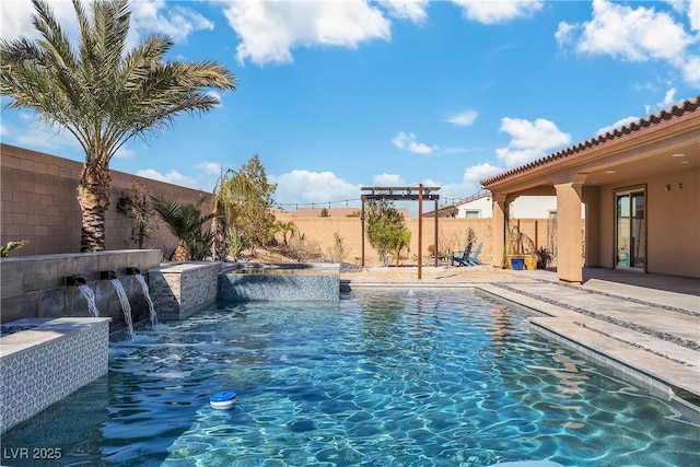 view of swimming pool with a fenced backyard, a pool with connected hot tub, and a patio area