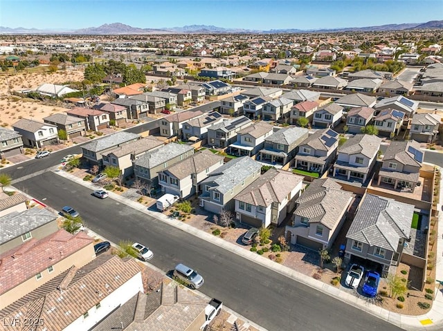 drone / aerial view with a residential view and a mountain view