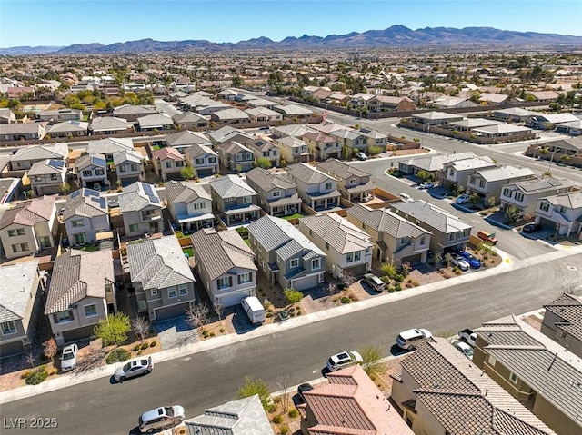 drone / aerial view featuring a mountain view and a residential view